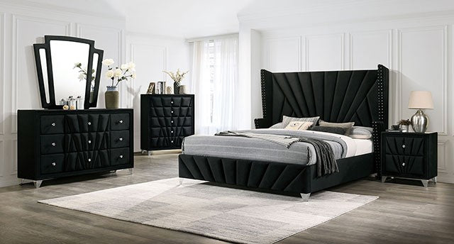 Black bedroom furniture set with a bed, dresser, and nightstands in a room.