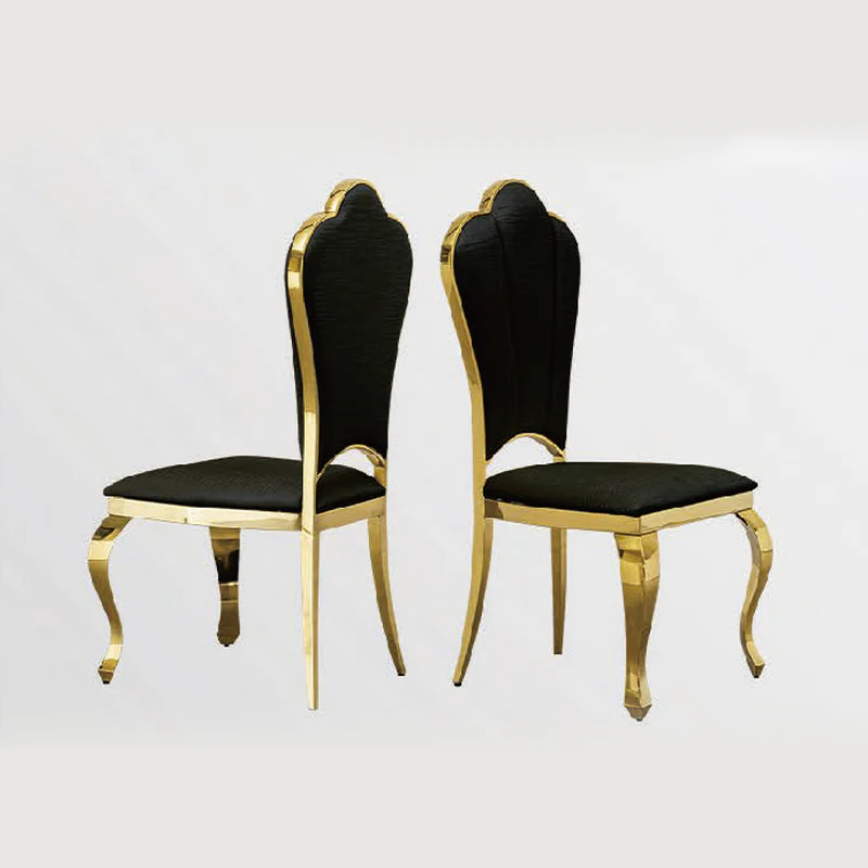 Two black chairs with gold frames on a white background