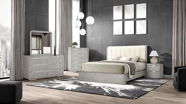 Modern bedroom with gray furniture and large windows.