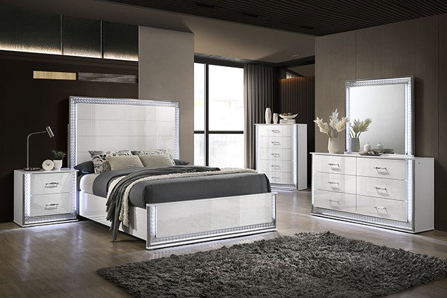 Modern bedroom set with mirrored furniture in a stylish room.