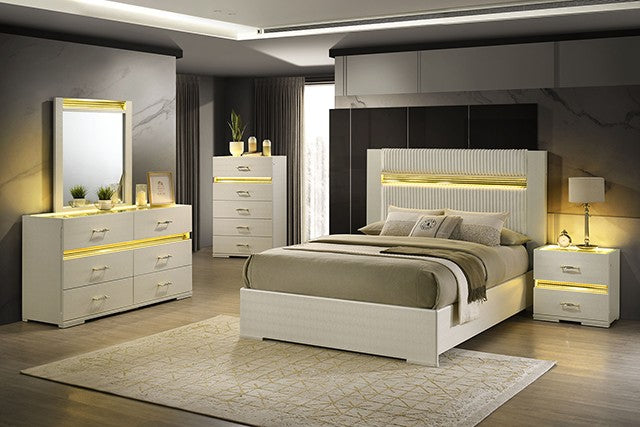 Modern bedroom set with white furniture, including bed, dressers, and nightstands, featuring LED lighting.