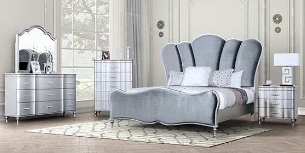 Silver bedroom furniture set with bed, dresser, and nightstands in a room.