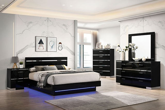 Modern bedroom set with black furniture and LED lighting in a well-lit room.