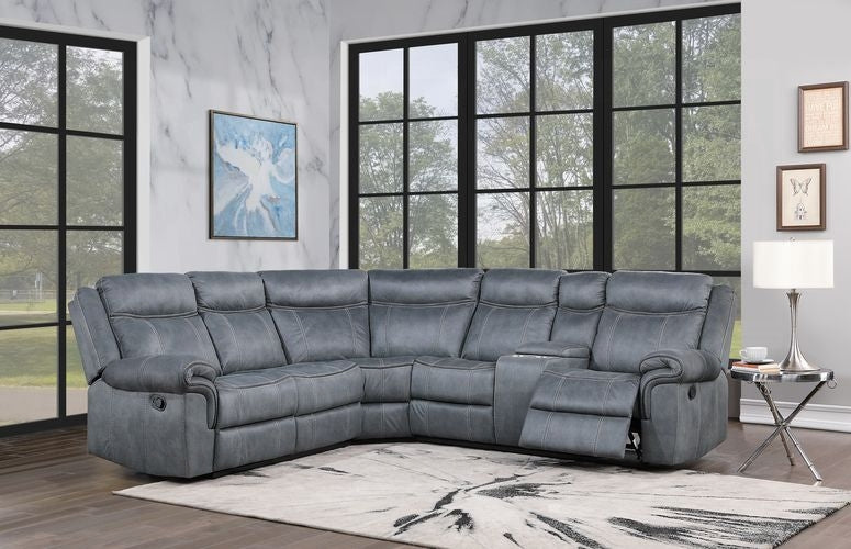 Gray sectional sofa in a room with large windows and decorative elements.
