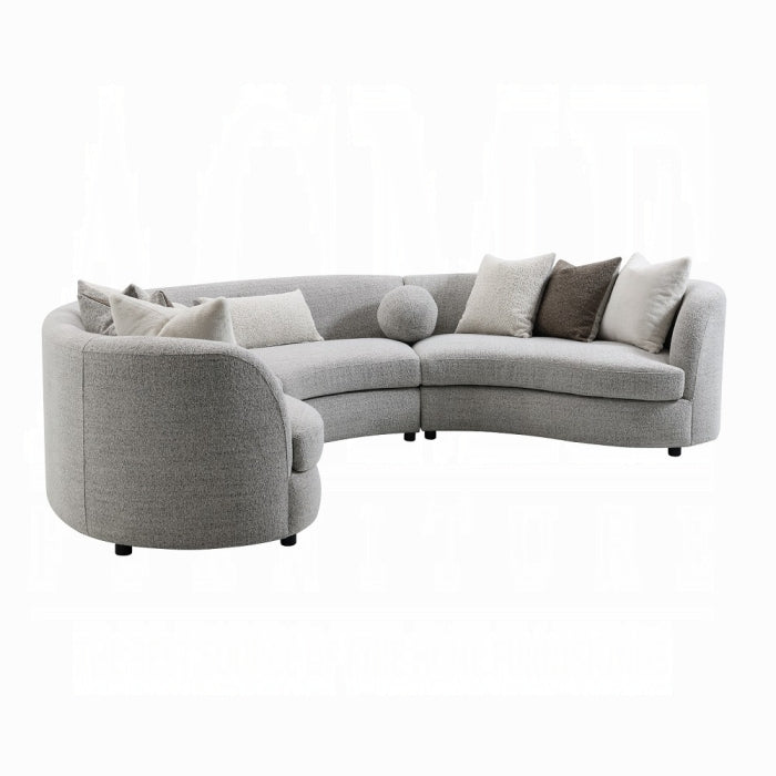 Gray sectional sofa with cushions on a white background