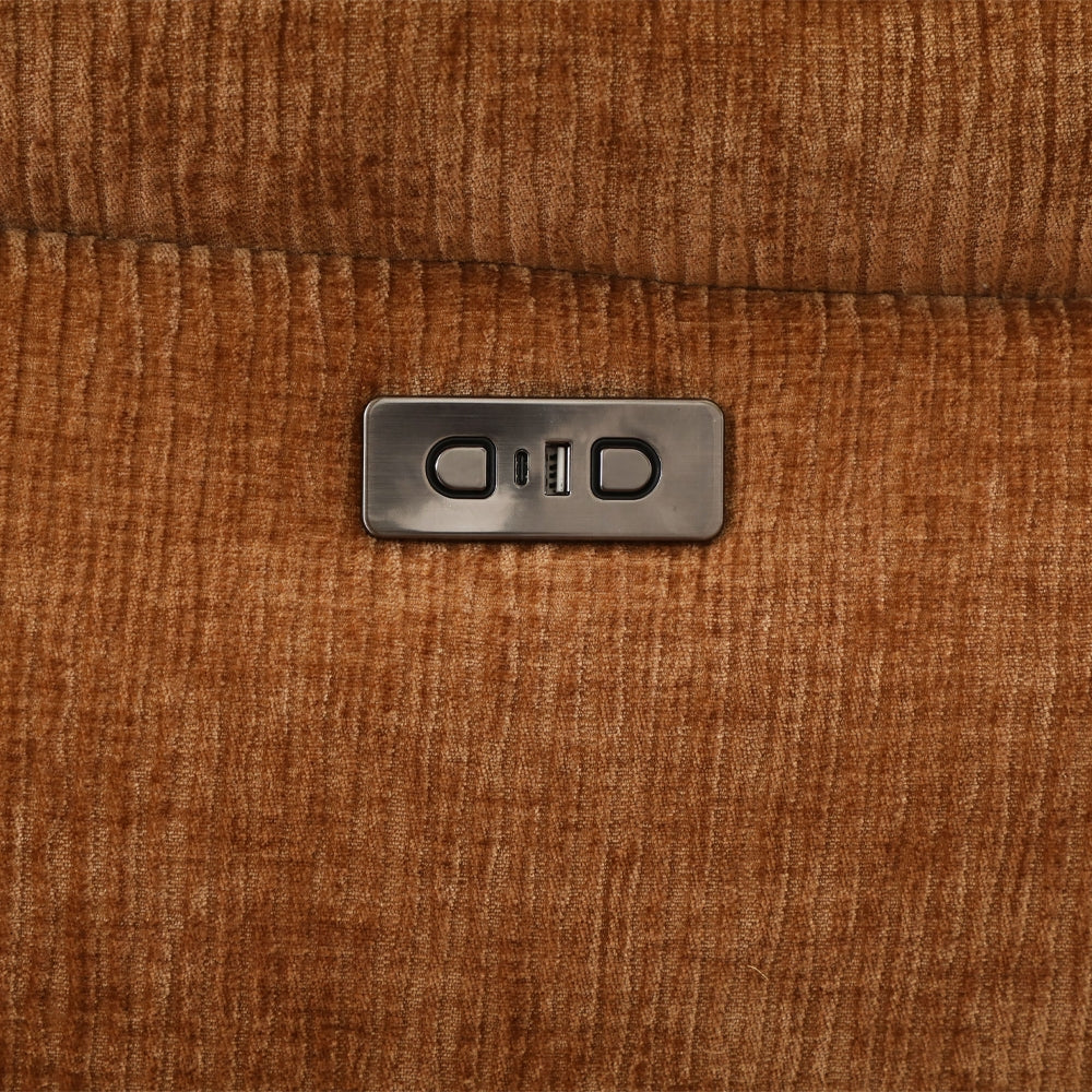 Close-up of a brown textured surface with a metallic label for reclining.