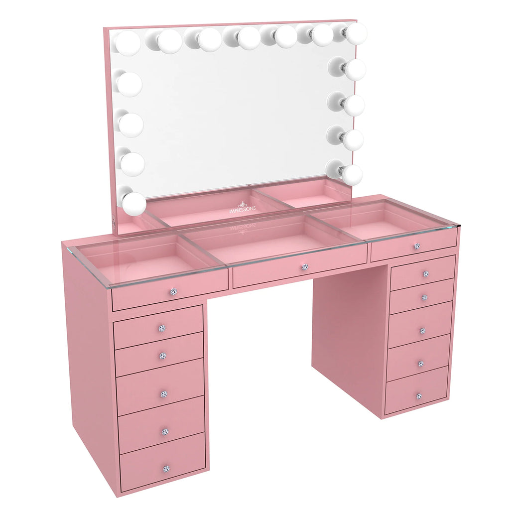 Pink vanity desk with mirror and lights on a white background