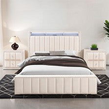 Modern cream white bedroom setup with a bed, nightstands, and lamps in a well-lit room.
