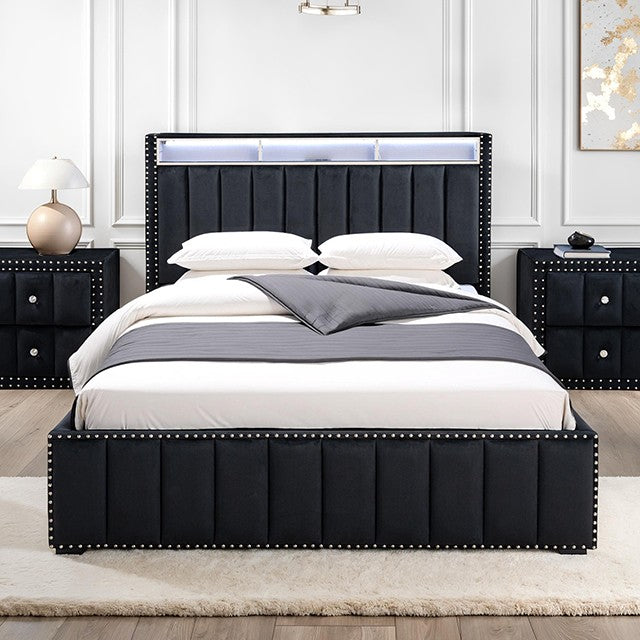 Black upholstered bed with white bedding in a bedroom setting