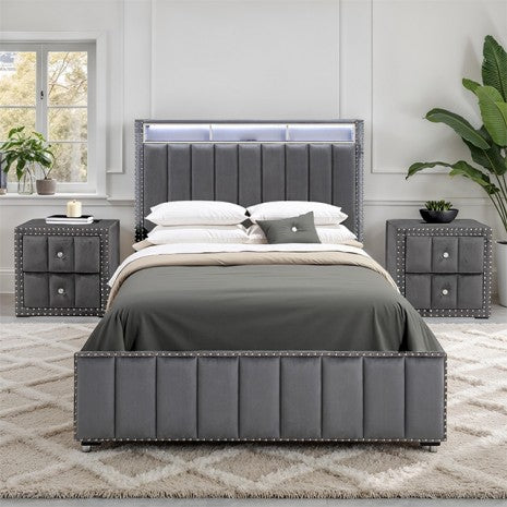 Gray upholstered bed with matching nightstands in a bedroom setting.
